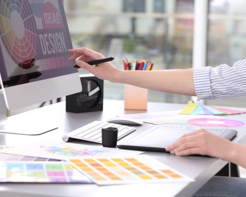 Young designer drawing sketches on graphic tablet, closeup