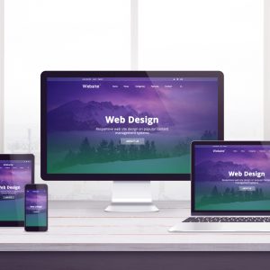 Responsive web site concept on multiple devices. Work desk with window in background. Modern flat web design with purple green page concept.